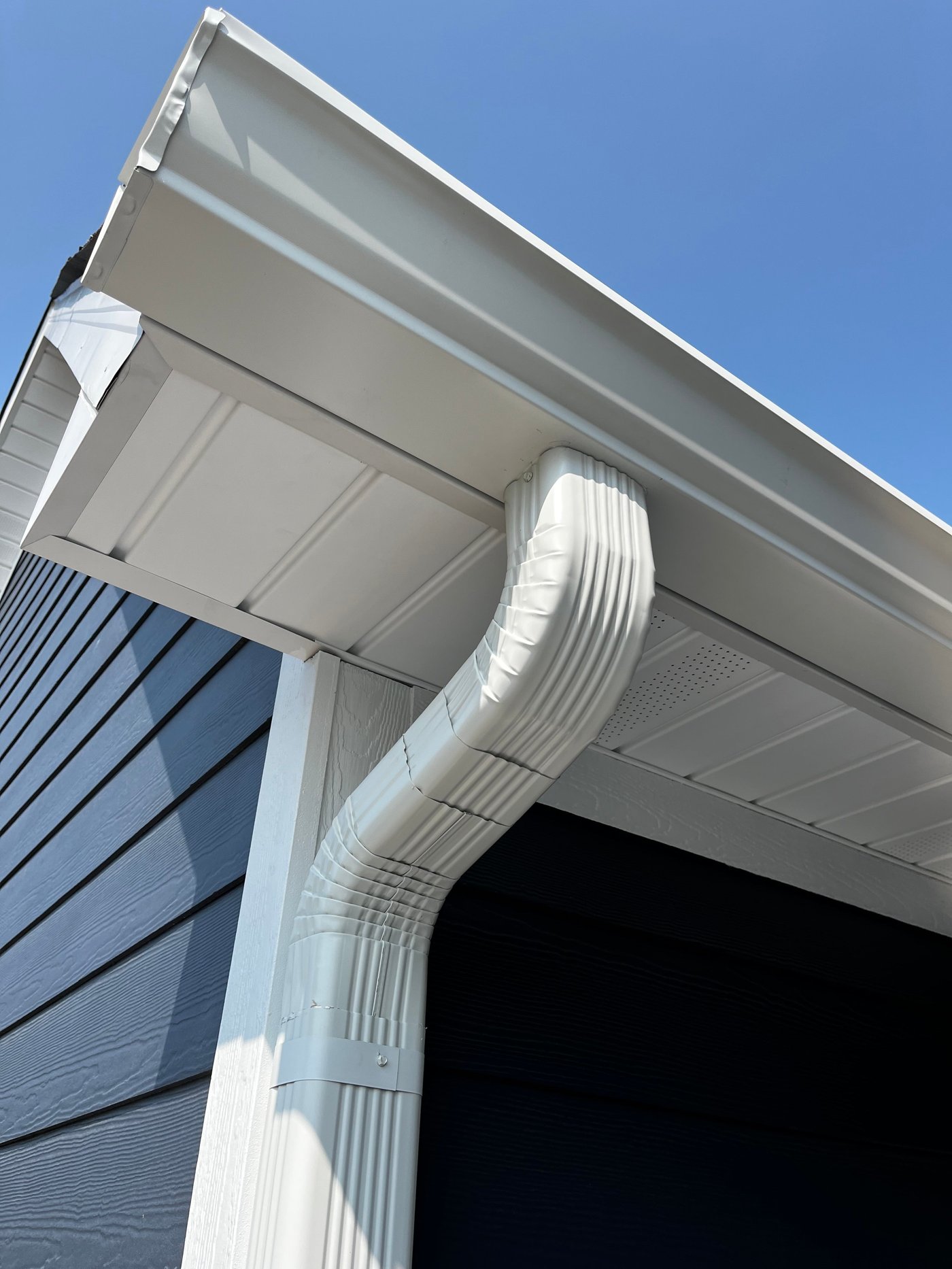 Soffit venting and fascia trim under a covered porch by Gutter And Covers, Cookeville